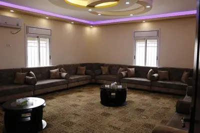 a living room with a couch and a table at Petra Mountain House in Wadi Musa