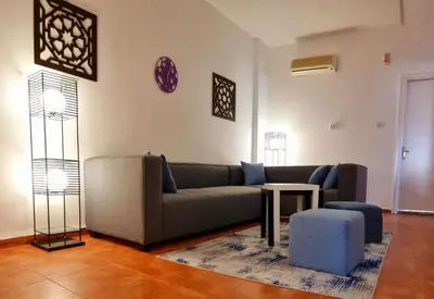a living room with a couch and a table at Byblos Aqaba in Aqaba