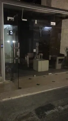 a glass window of a building on a street at Abdoun studio in Amman