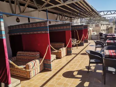a row of chairs and tables on a patio at Golden View in Aqaba