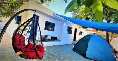 a tent in front of a house at Mango Haus in Aqaba