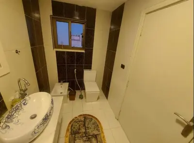 a bathroom with a sink and a toilet and a shower at The view IV in Amman