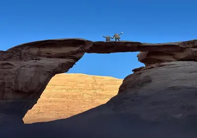two animals standing on top of a rock formation at Wadi rum stay in Wadi Rum