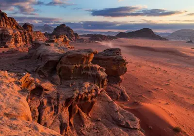 a view of the desert with rocks and mountains at Wadi rum stay in Wadi Rum
