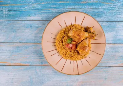 a plate of food with chicken and rice at Wadi rum stay in Wadi Rum