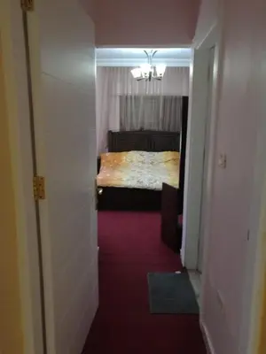 a bedroom with a bed in a room at Dream Home in Amman