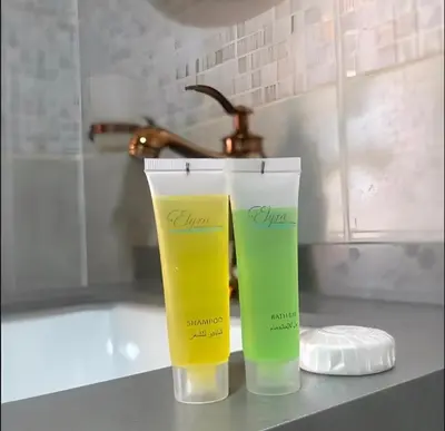 two cups sitting on a counter next to a bath tub at RUM ARJAAN lUXURY CAMP in Wadi Rum