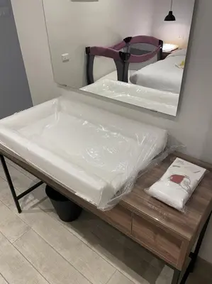 a bed is wrapped in plastic in front of a mirror at Zerø Føur DeadSea in Sowayma