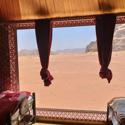 a window with a view of the desert at غرووب وادي رم in Wadi Rum