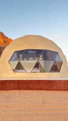 a large dome building in the middle of the desert at Wadi rum sky luxury in Wadi Rum