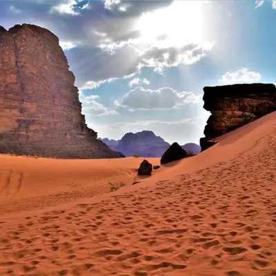 a view of a desert with rocks and sand at Bedouin oasis in Wadi Rum