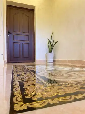 a room with a door and a potted plant in front at بيت العُمري (ام قيس) in Um Qeis