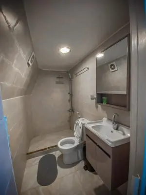 a small bathroom with a toilet and a sink at Tower Rum Camb in Wadi Rum