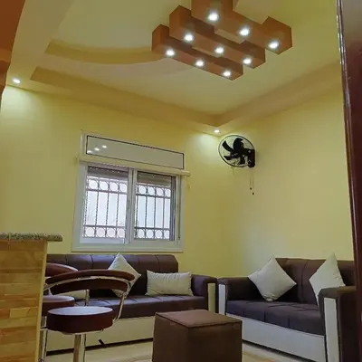 a living room with a couch and a window at Leen Guest House in Wadi Musa
