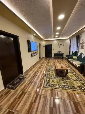 a living room with a couch and a table at Ad Deir Guesthouse in Wadi Musa