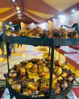 a pile of food sitting on top of a stand at Youssef camp Wadi Rum in Wadi Rum