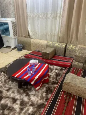 a living room with a couch and a table at Bedouin experiences in Aqaba