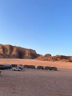 a group of benches sitting in the desert at Wadi Rum Cream in Wadi Rum