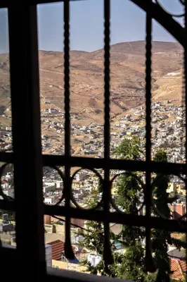 a view of the city from a window at Twilight Hotel Petra in Wadi Musa