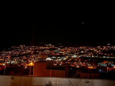 a view of a city lit up at night at Twilight Hotel Petra in Wadi Musa