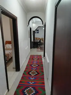 a hallway with a colorful carpet on the floor at شقه مفروشة الجبيهه in Amman