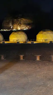 a group of domes in a cave at night at Rum Darien Camp in Wadi Rum