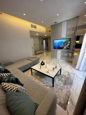 a living room with a couch and a coffee table at Downtown pearl Amman in Amman
