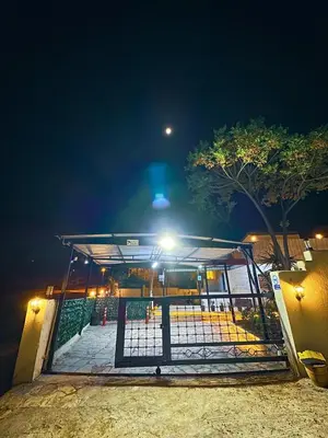 a gate at a bus stop at night at Panorama Jerash HOTEL (2) in Jerash