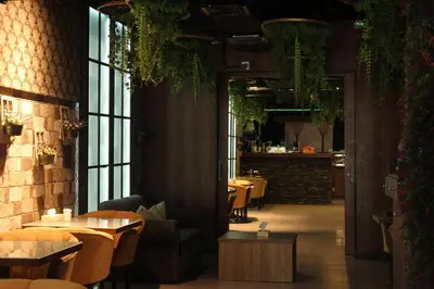 a restaurant with tables and chairs in a room at Amman Inn Boutique Hotel in Amman