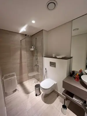 a bathroom with a shower and a toilet and a sink at Ayla and chill Restricted to families and couples only in Aqaba