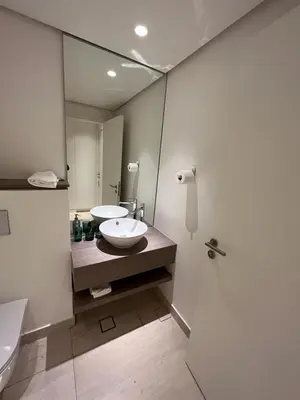 a bathroom with a sink and a mirror at Ayla and chill Restricted to families and couples only in Aqaba