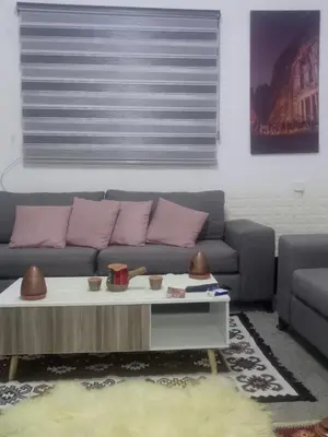a living room with a couch and a coffee table at taila hostel in Wadi Musa