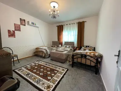 a living room with a couch and a table at taila hostel in Wadi Musa