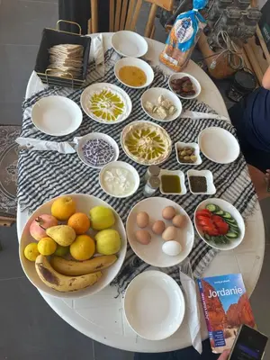a table with plates of food on a table at Pasha's house in Balad al Manşūrah