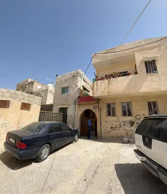 a car parked in front of a building at Al Karak House in Kerak