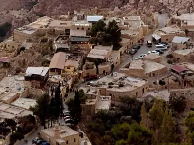 an aerial view of a small town with buildings and cars at Dana Sunset Village Hotel in Dana