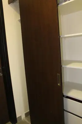 an open refrigerator with a wooden door in a room at Samarah Dead Sea Resort Apartment with Sea View FP4 Traveler Award 2025 Winner Thursday, Friday & Saturday Groups consisting solely of male guests are not permitted in Sowayma