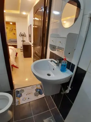 a bathroom with a sink and a toilet at MK2 - One Bedroom Apartment in Amman
