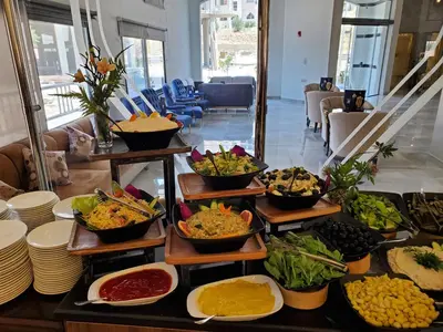 a buffet with different types of food on display at Petra Icon Hotel in Wadi Musa