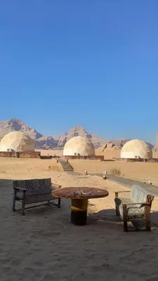 two benches and a table in the desert at Panorama bubble camp in Disah