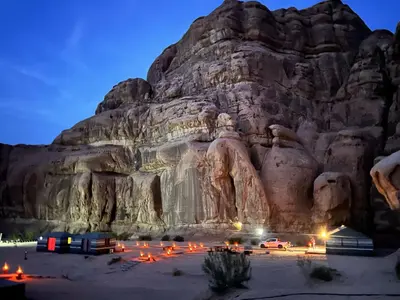 a view of a mountain with cars parked in front at Panorama bubble camp in Disah