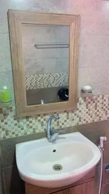 a bathroom sink with a mirror above it at Panorama bubble camp in Disah
