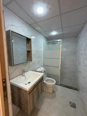 a bathroom with a sink and a toilet at Red Twilight Camp in Disah