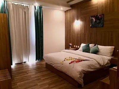 a bedroom with a large bed and a window at Castle beach hotel in Aqaba