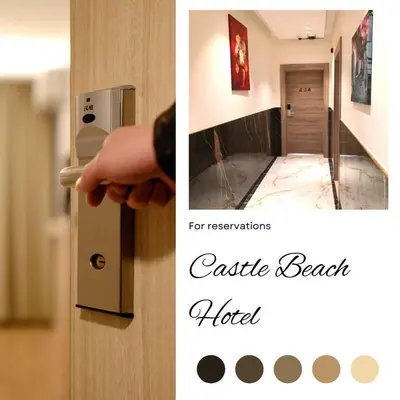 a hand is opening a door to a room at Castle beach hotel in Aqaba