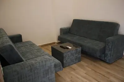 a living room with two couches and a coffee table at Castle beach hotel in Aqaba