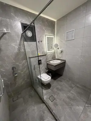 a bathroom with a toilet and a sink at Sky Hotel in Aqaba