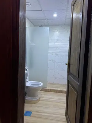 an open door to a bathroom with a toilet at Wadi Rum alsultan Camp in Wadi Rum
